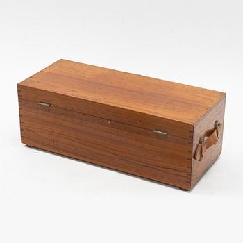 A teak box with 21 glass blottles, early 20th Century.