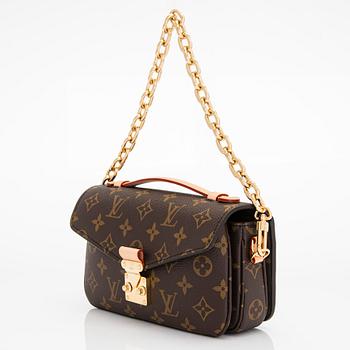 Louis Vuitton, a Monogram Canvas "Pochette Métis East West" bag.