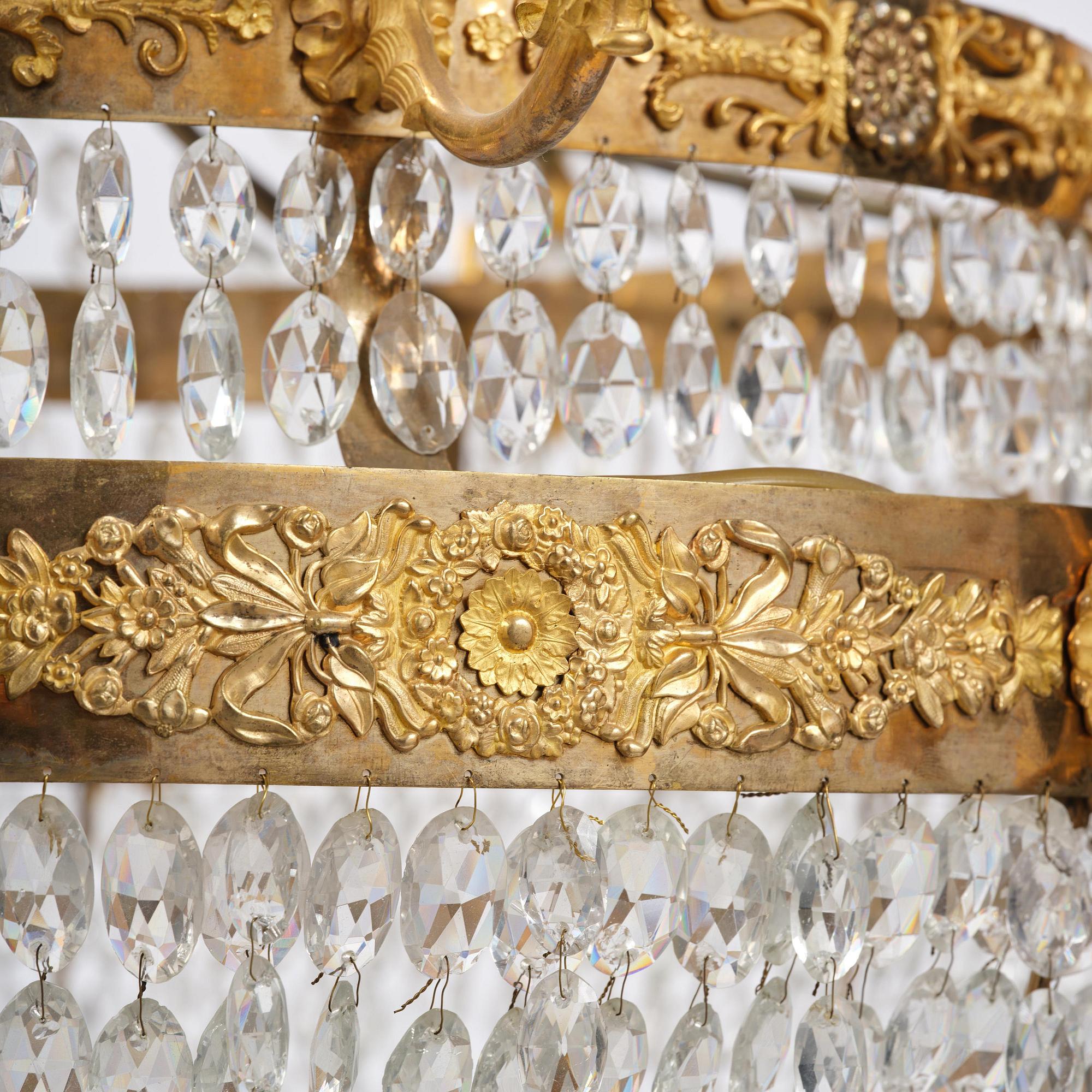 An ormolu and cut glass sixteen-branch Empire chandelier, Paris, early 19th century.