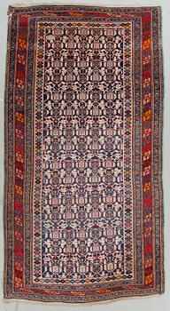 An antique Caucasian carpet, 261 x 140 cm.