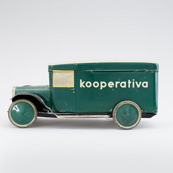 A tinplate biscuit jar in the shape of a truck 1930s.