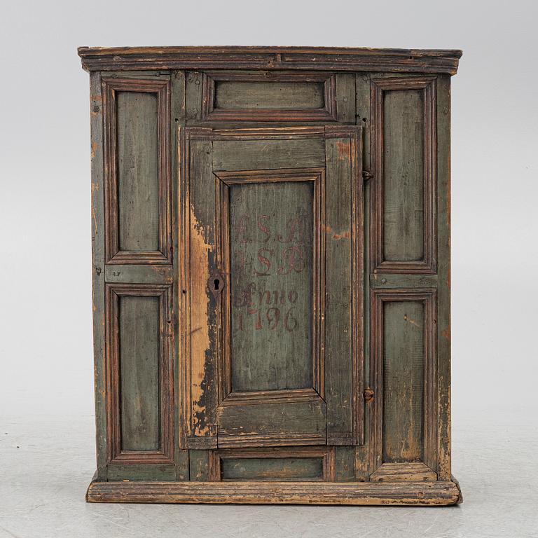 A wall-hanged cabinet, Sweden, dated 1796.