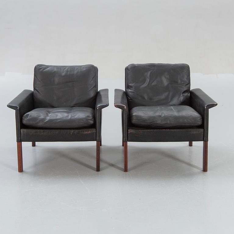 A pair of 1960s leather easy chairs.