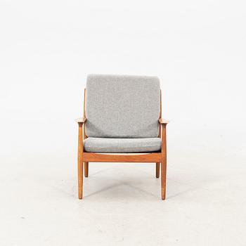 A Grete Jalk teak armchair and sofa from Glostrup Denmark, 1960s, marked.