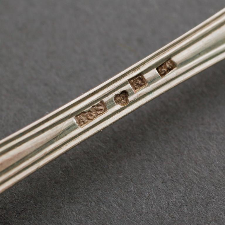 A silver set of table ware, 27 pcs, 19th and 20th century.
