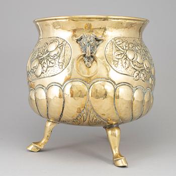 A 19th century brass champagne cooler.