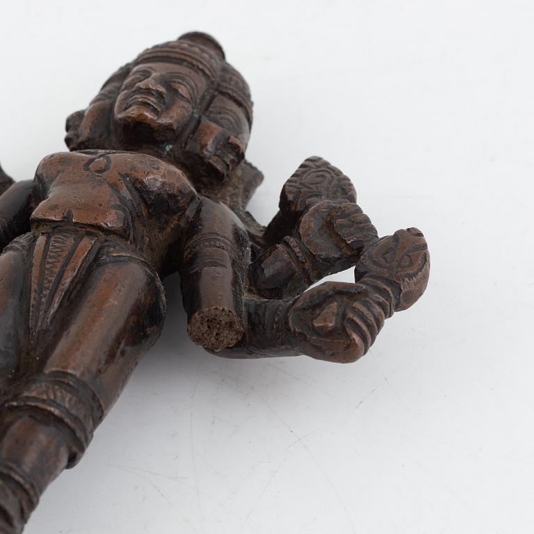 A group of three Indian bronze figures and an ewer, 20th century.