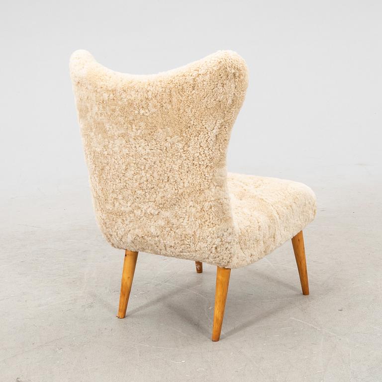 A Swedish Modern 1940s sheep skin armchair.