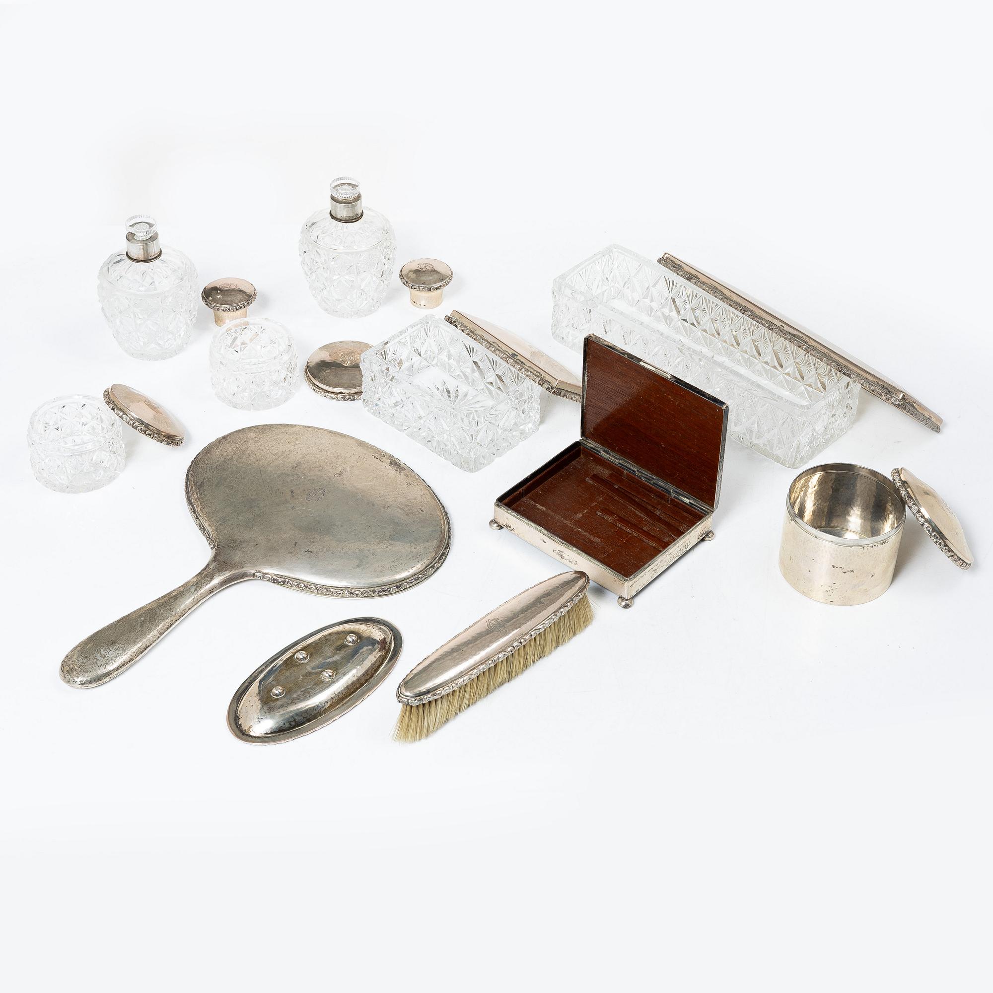 A K.Andersson silver and cut glass 'toilette set', monogrammed 'PG'. (11 pieces).