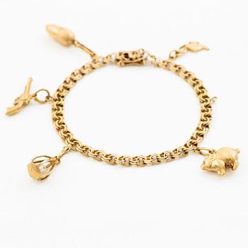 Armband, 18K guld med berlocker.