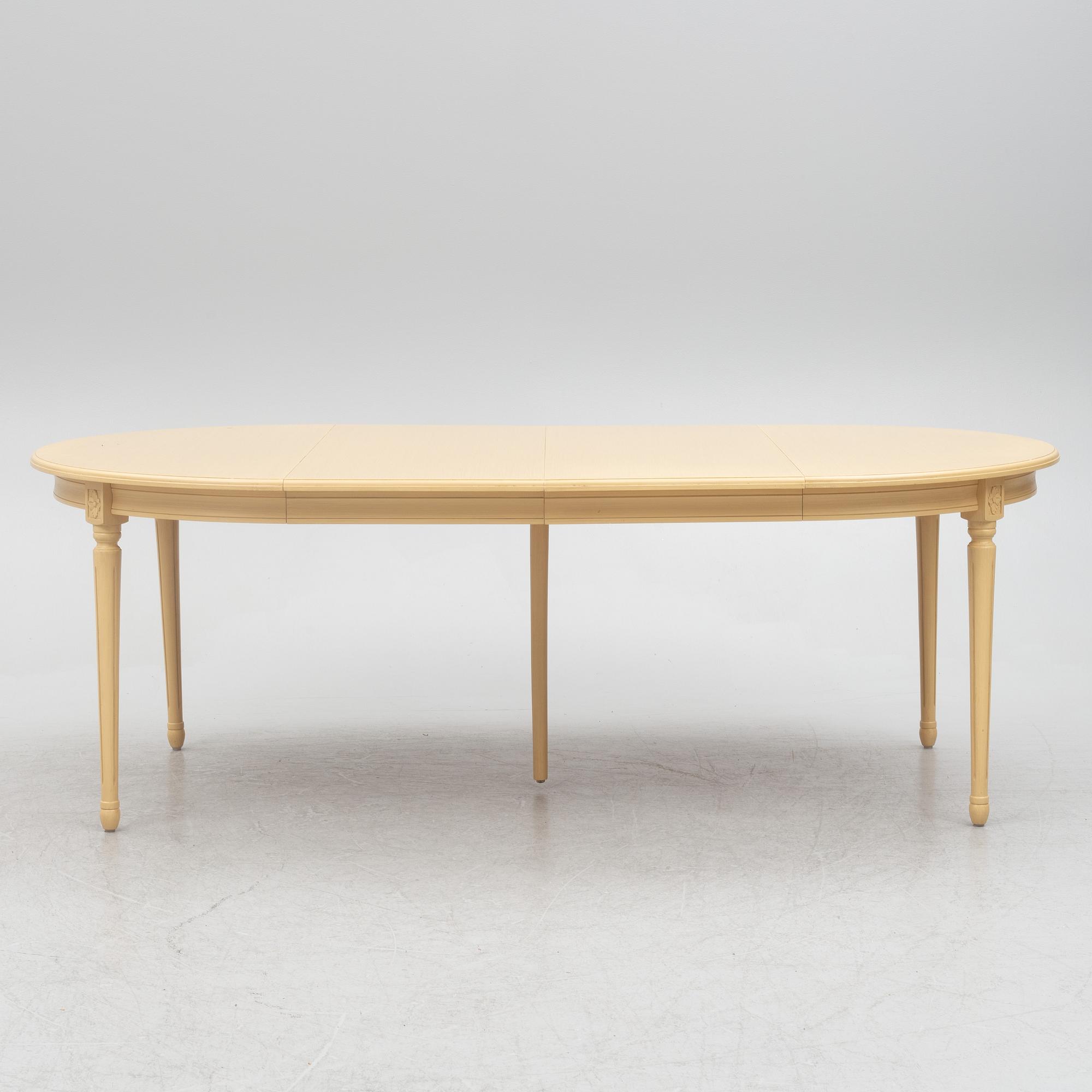A Gustavian style dining table with six dining chairs, Sweden, 21st century.