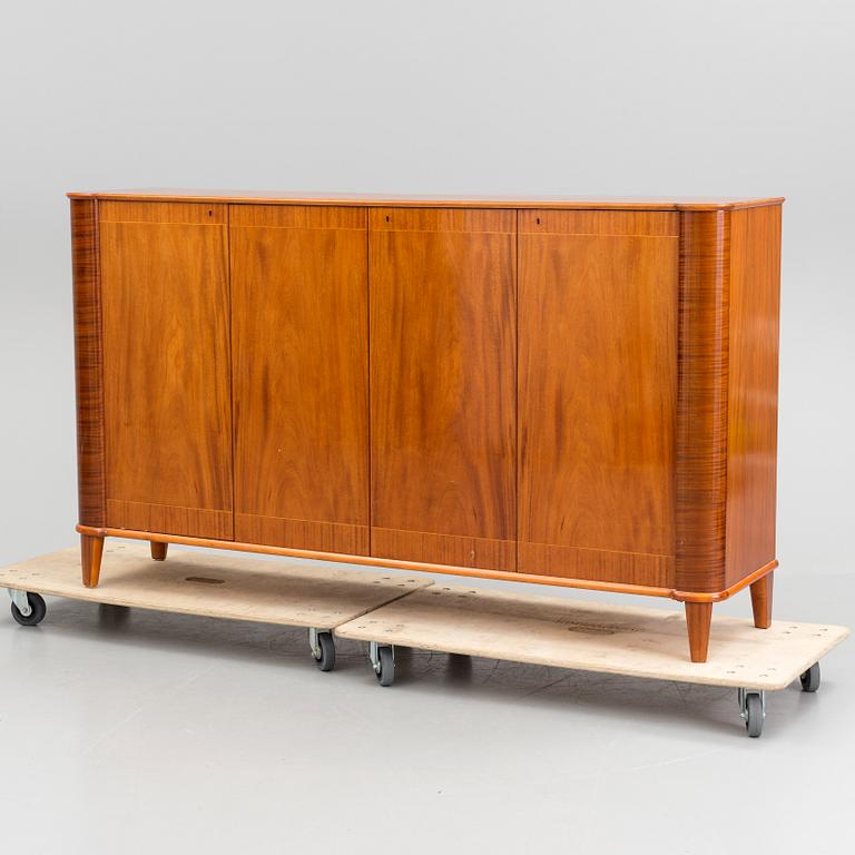 A 20th century mahogany sideboard with four doors.