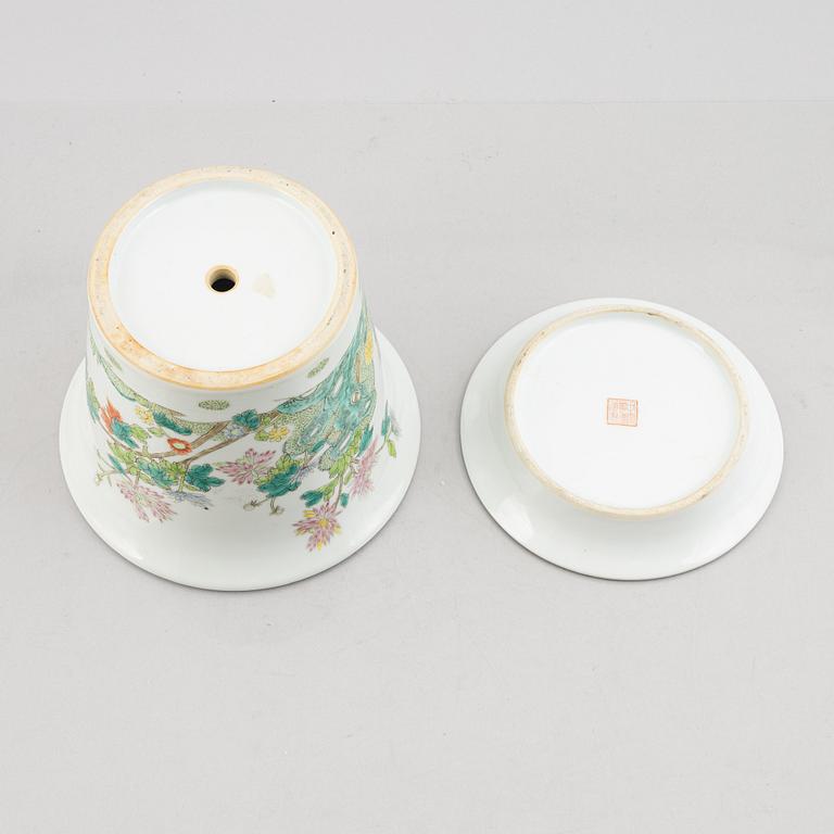 A porcelain plate and a flower pot with stand, China, 19th & 20th century.
