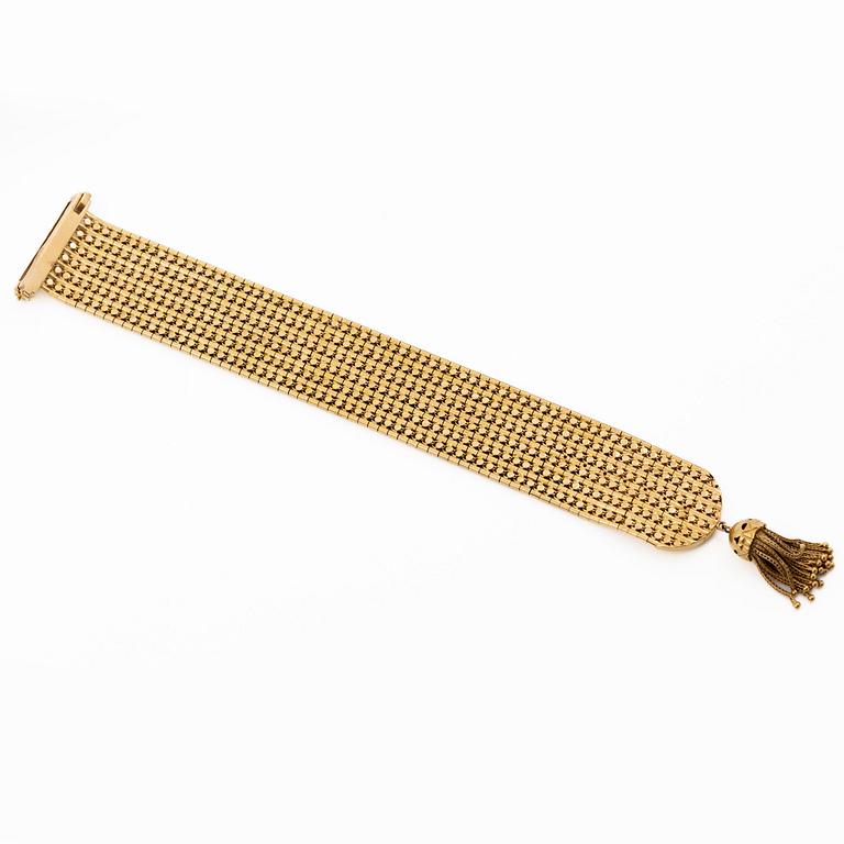Armband 18K guld med tofs, 1900-talets andra hälft.
