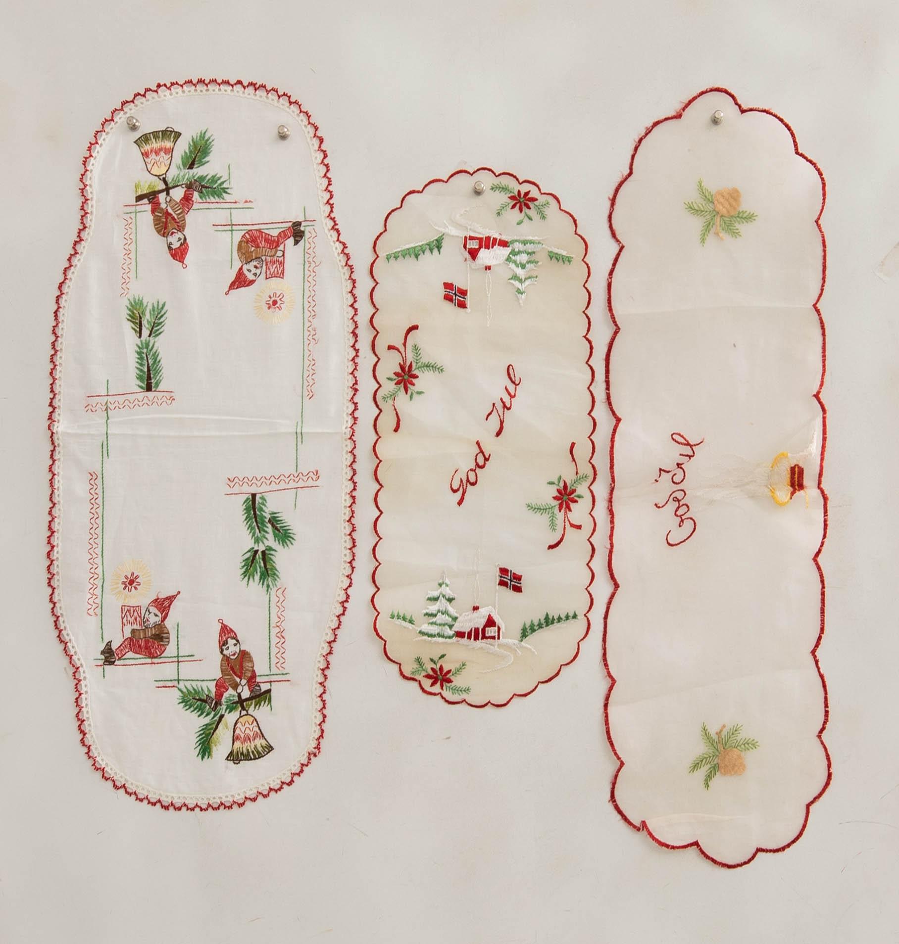 A collection of smaller Christmas tablecloths, runners, and wall hangings, approximately 34 pieces, mid/second half of the 20th century.