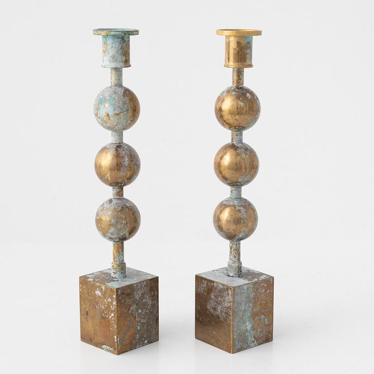 Sigurd Persson, a pair of 'Tre kulor' candlesticks, Firma Svenskt Tenn.