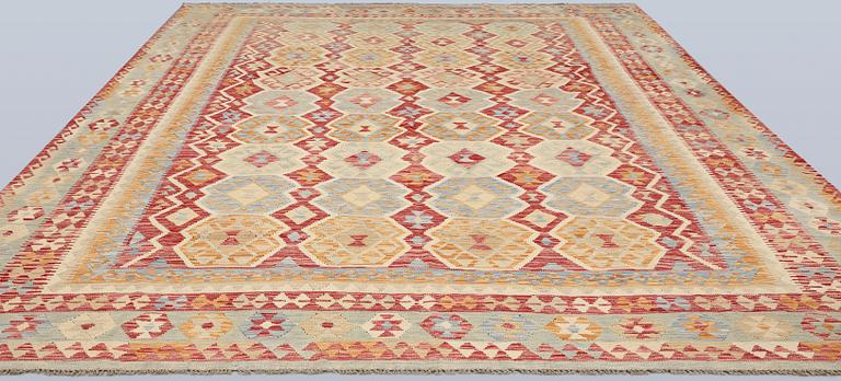 A Kilim carpet, approx. 392 x 309 cm.