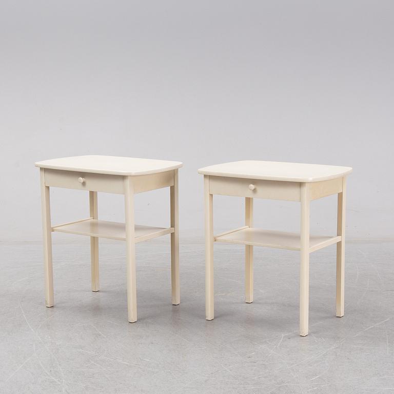 A mid 20th Century pair of bedside tables.