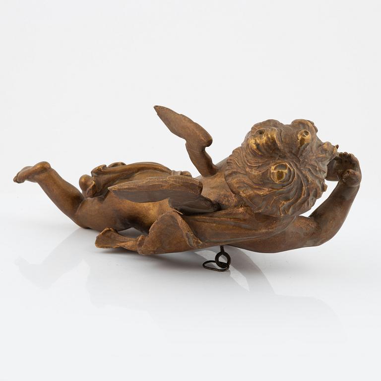 A carved and giltwood sculpture of a putto, 18th and 19th century.