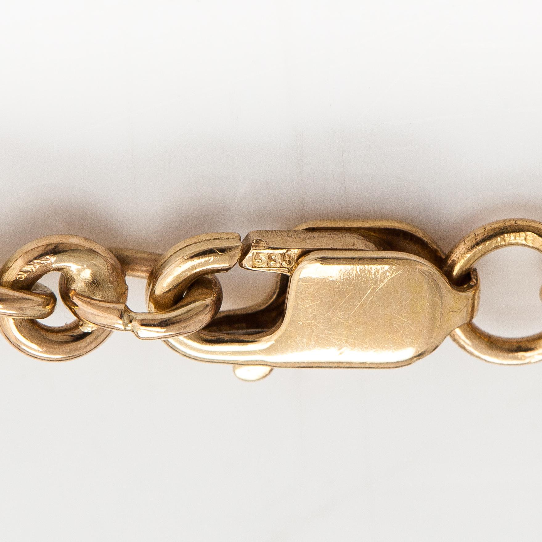Rannkoru, 14K kultaa, timantteja n. 0.12 ct yht ja safiireja.