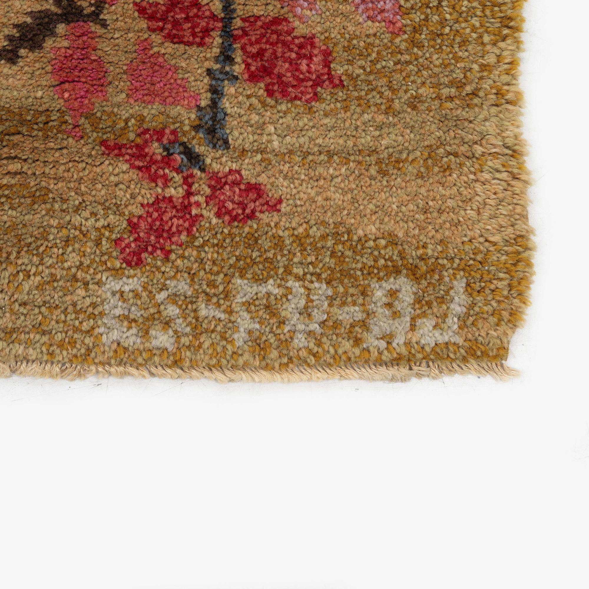 A knotted pile carpet, c. 275 x 177 cm, signed ES-FV-AJ.