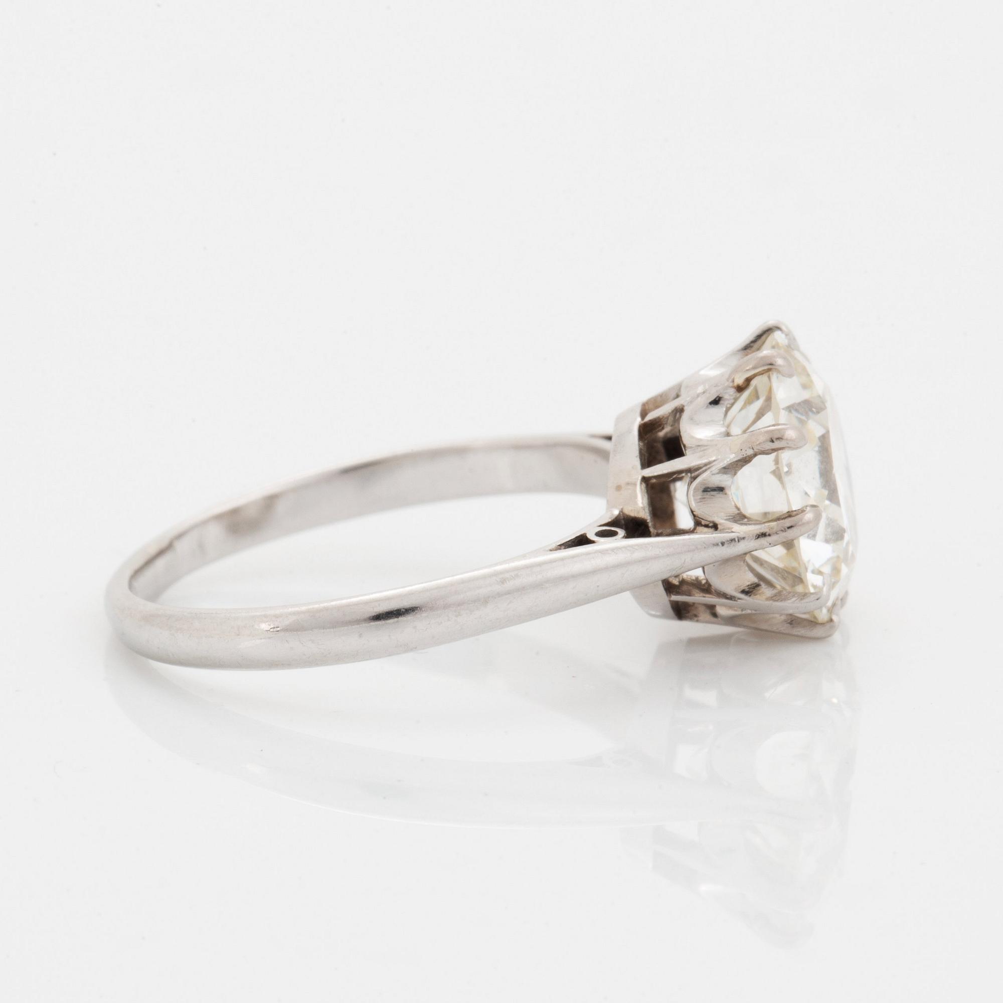 A platinum ring set with an old-cut diamond ca 3.30 cts quality ca J/K vs.