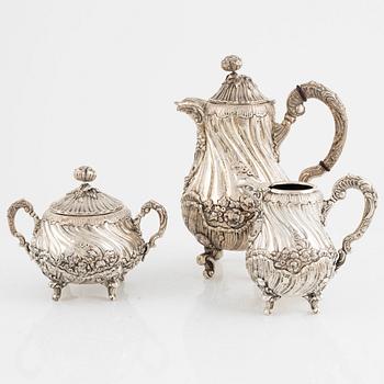 A silver coffee-pot, a reamer and a sugar box with lid. Swedish import mark.