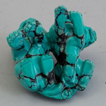 A Chinese carved turquoise sculpture, 20th century.