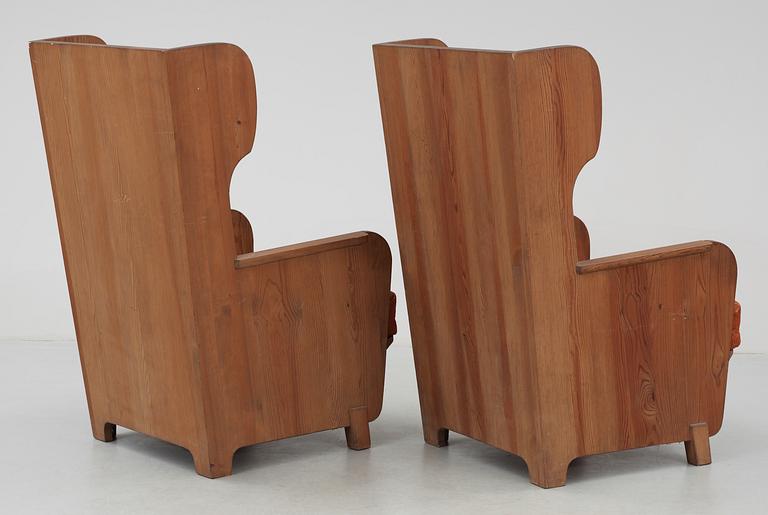 A pair of Axel-Einar Hjorth 'Lovö' pine armchairs by NK, 1930's.