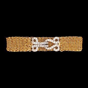 947. A gold and diamond clasp bracelet, turn of century 1900.