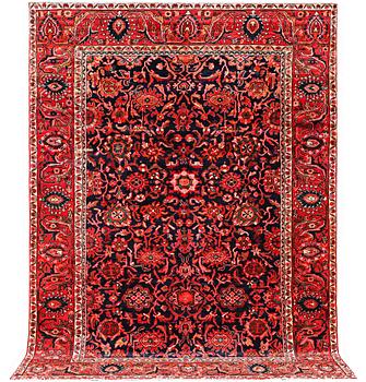 An oriental carpet, c. 305 x 220 cm.