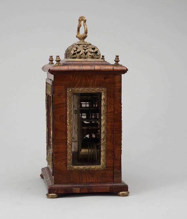 A Queen Anne early 18th century brass-mounted walnut striking table clock by Jacobeus Markwick.