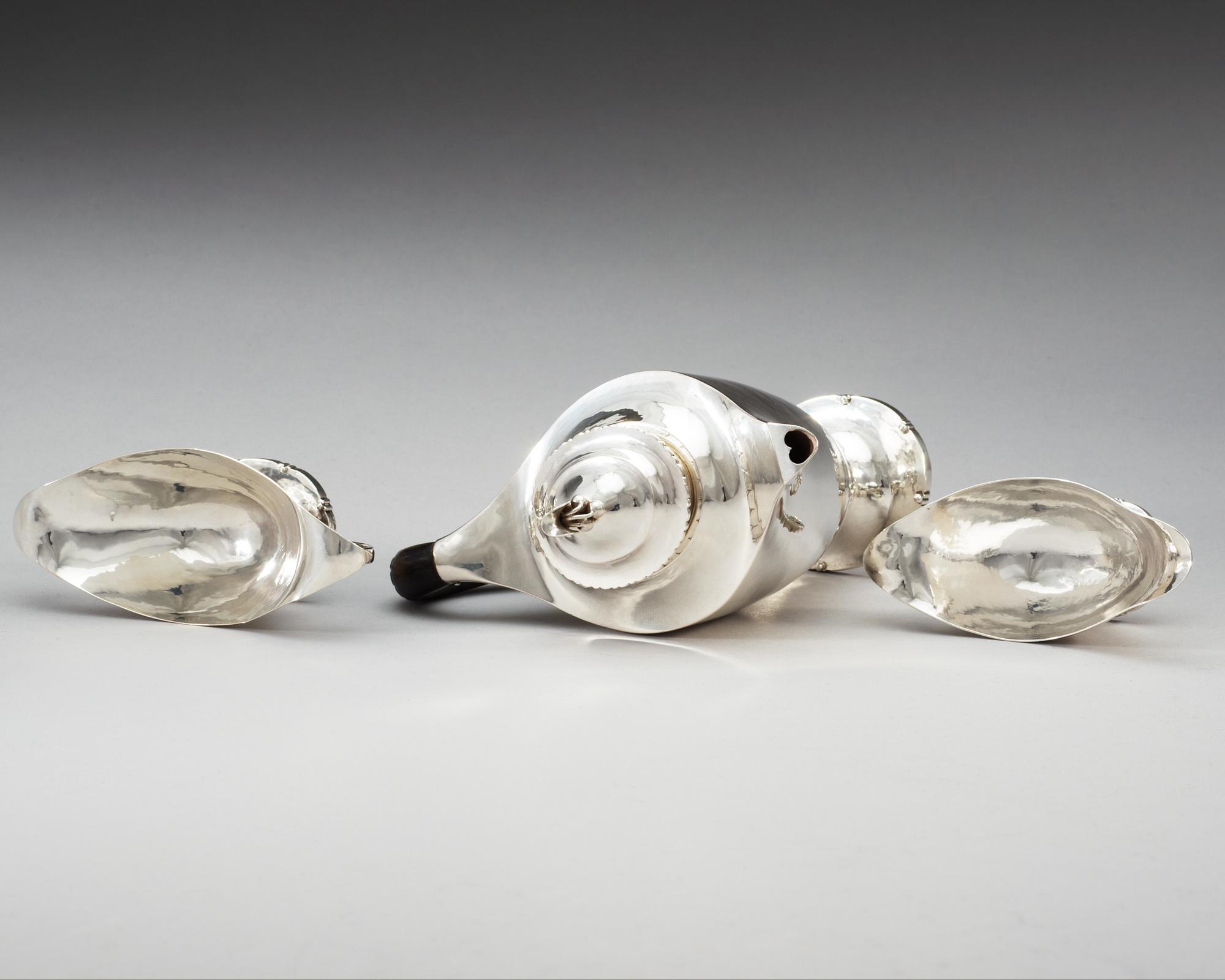 A Georg Jensen three pieces of 830/1000 silver coffee service, Copenhagen 1919-20.