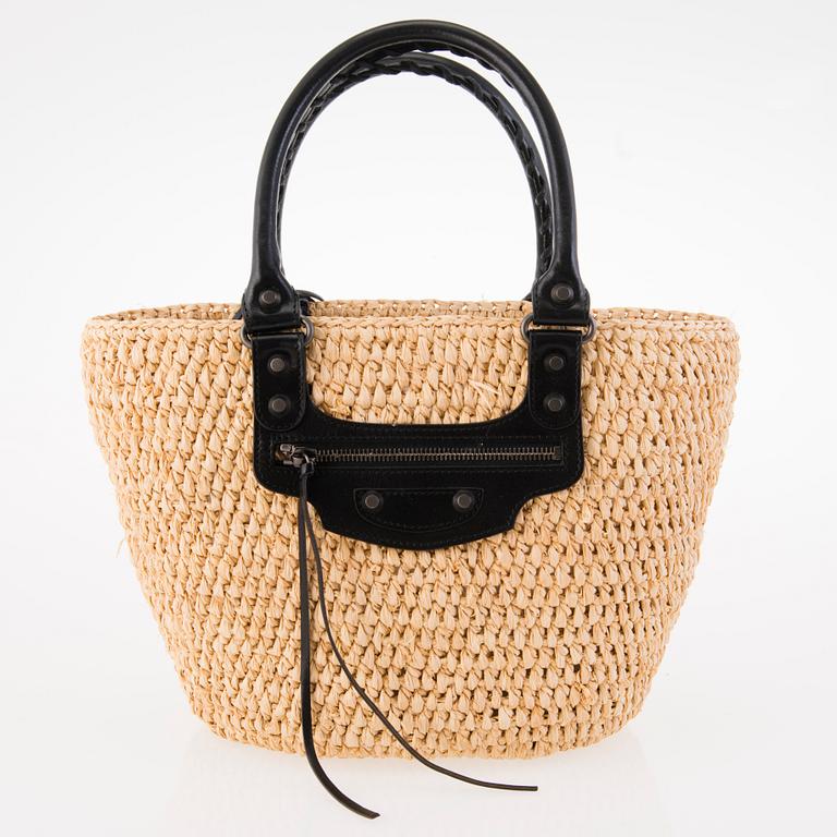 BALENCIAGA Panier leather-trimmed woven raffia tote with a silk scarf.