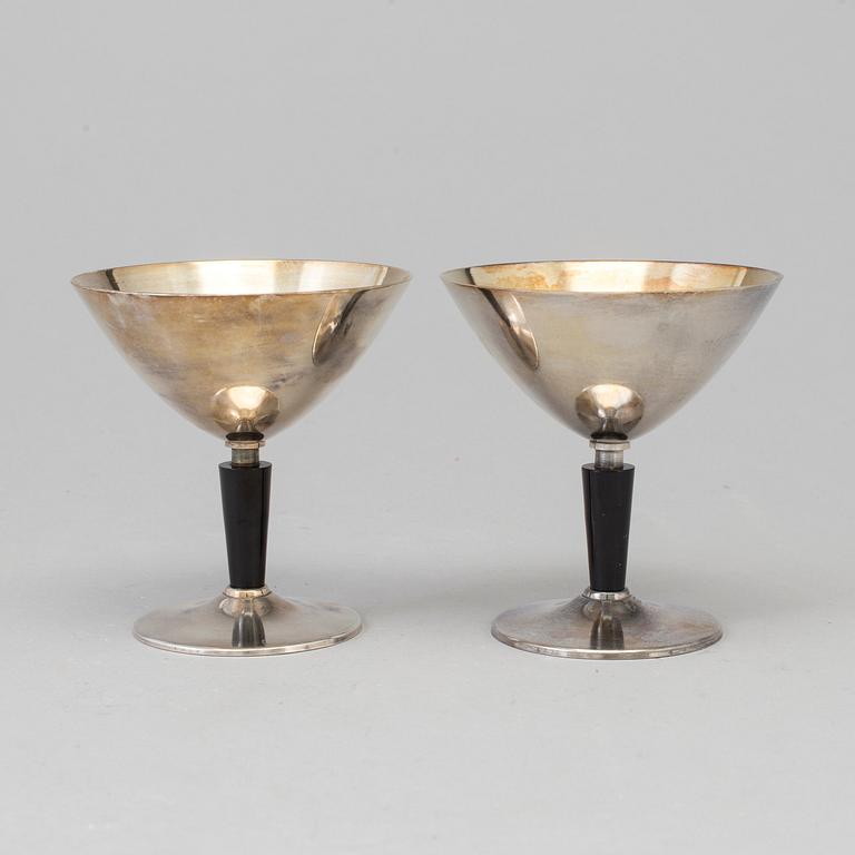 8 pcs of silverplated and bakelite cocktailglasses by Folke Arström.