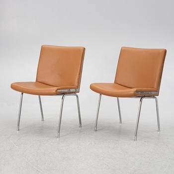 Hans J. Wegner, a pair pf "Kastrup Airport" lounge chairs, Denmark, late 20th century.