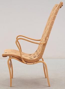 A Bruno Mathsson beech and paper webbing easy chair, Karl Mathsson, Värnamo 1940's.