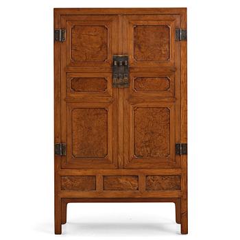 656. A huanghuali veneered, huamu and mixed wood cabinet, 19th century, Qing dynasty, 19th Century.