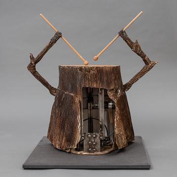 A drumming tree stump made by JoAnn Tan Studio for NK 2016.