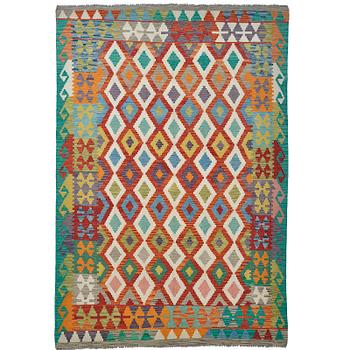 A kilim carpet, ca 293 x 203 cm.