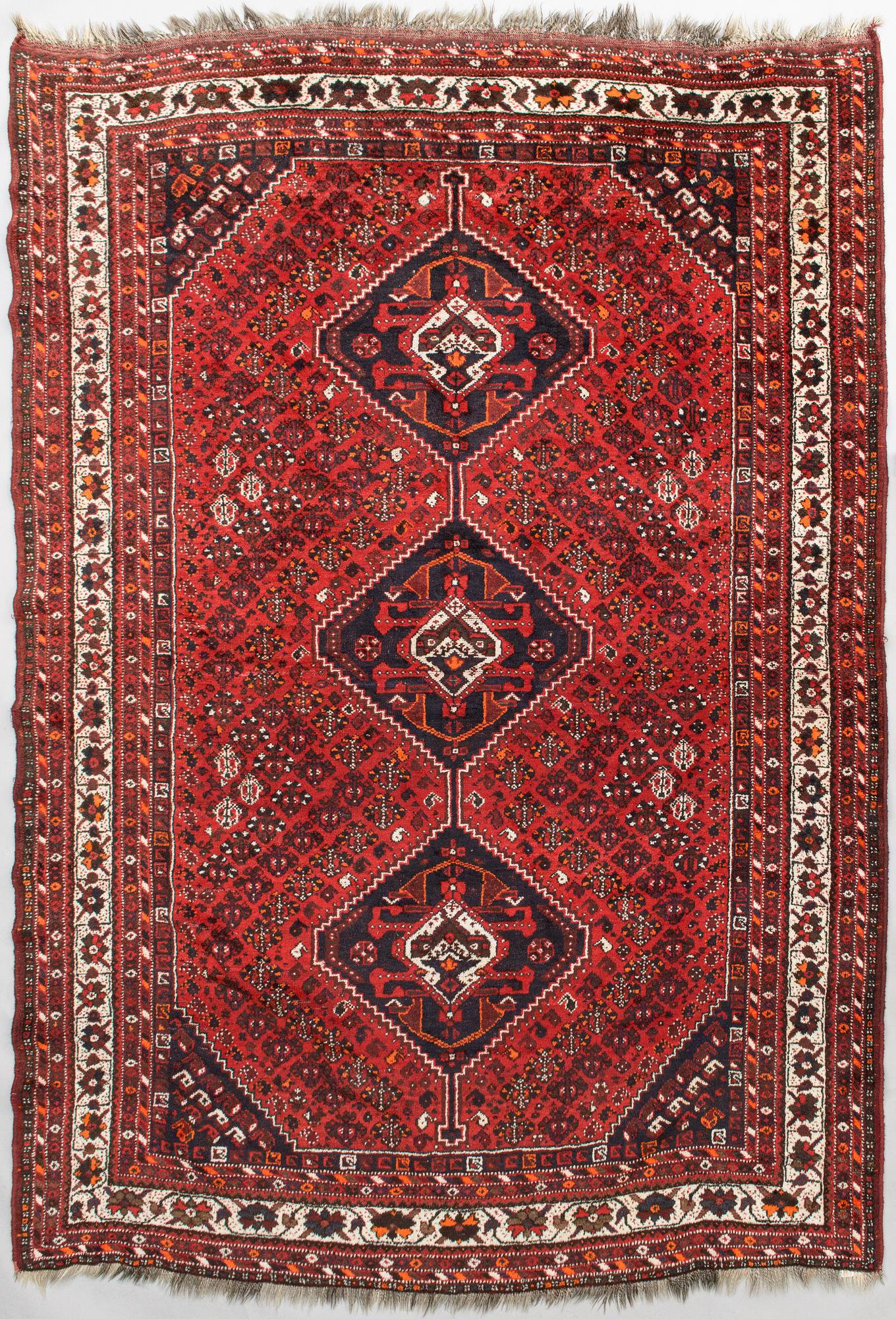 A oriental  carpet. Ca 220x320 cm.
