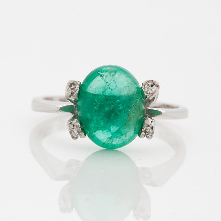 18K white gold cabochon emerald and diamond ring.