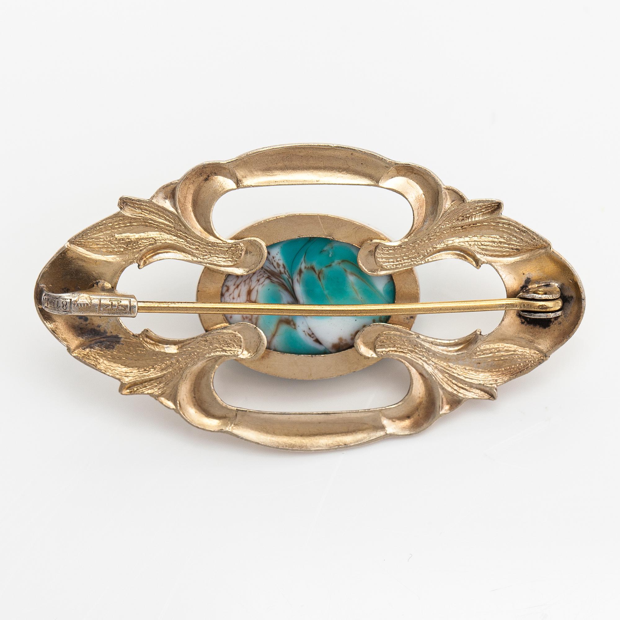 Elis Kauppi, A gilded silver brooch with a glass stone. Kupittaan kulta, Turku, 1940's.