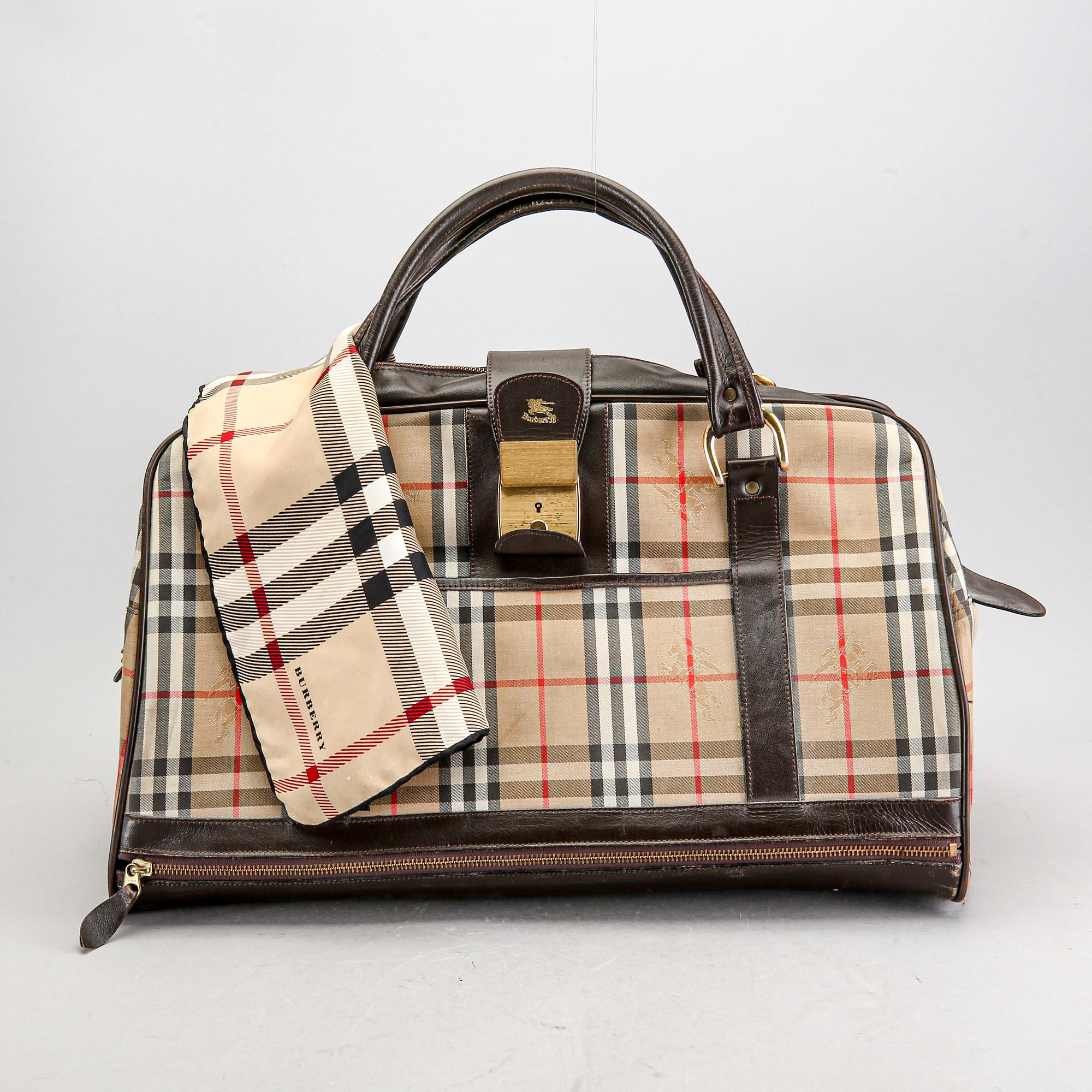 A Burberry weekend bag and scarf. Bukowskis
