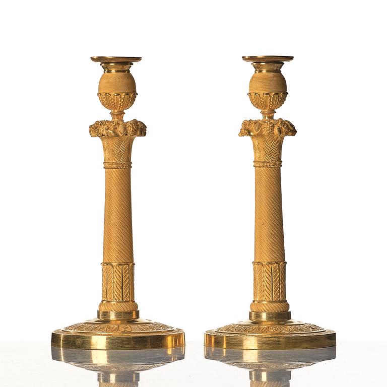 A pair of Empire early 19th century candlesticks.