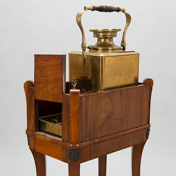 A brass samovar in a stand with a Kuznetsov porcelain teapot and bowl, latter half of the 19th century and early 1900s.