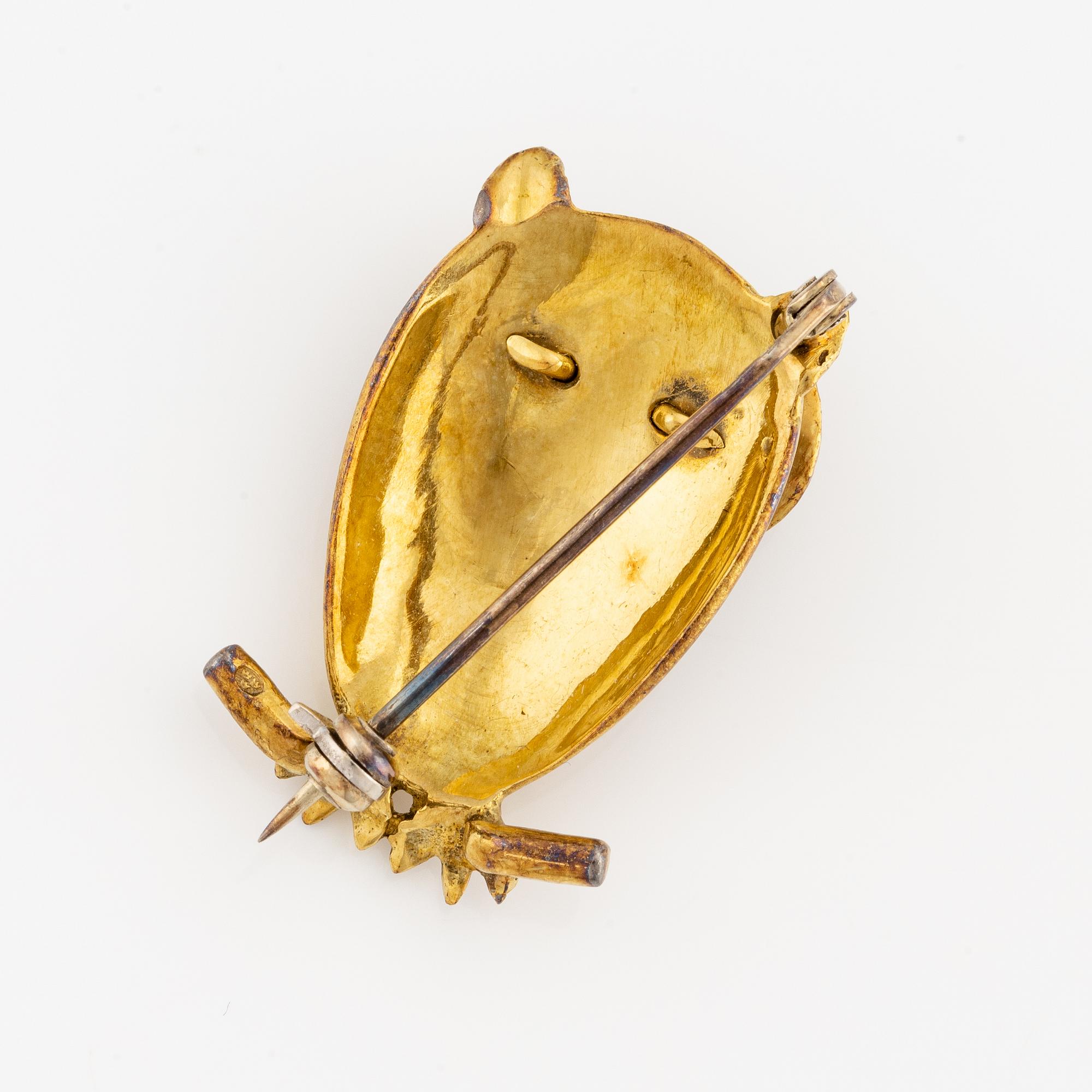 Brooch in the form of an owl, 18K gold with enamel.