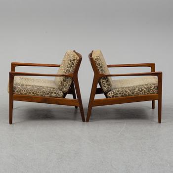 A pair of 'USA 75' teak easy chairs by Folke Ohlsson for Dux.