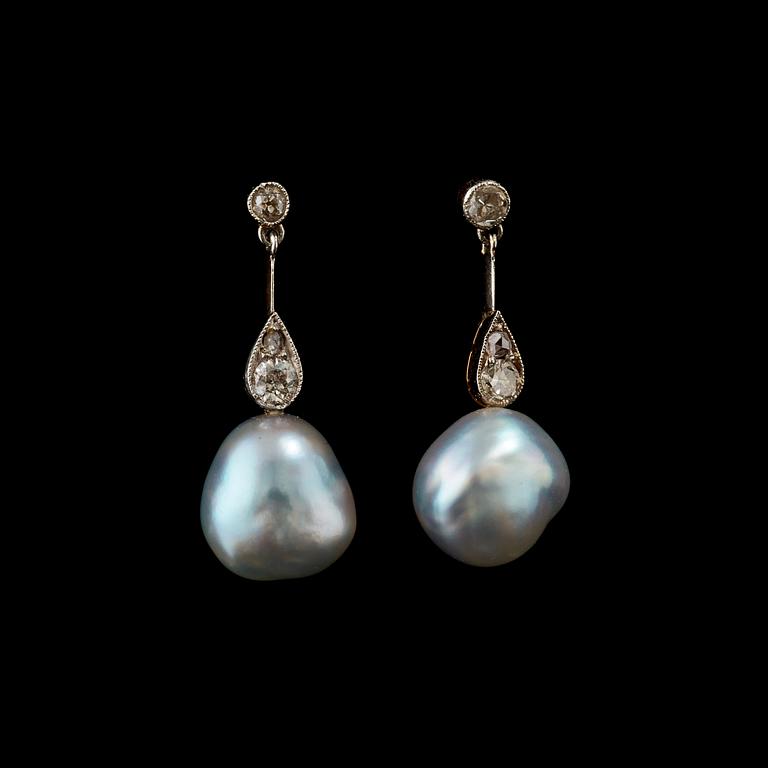 A pair of pearl, circa 10x12 mm, and diamond earrings.