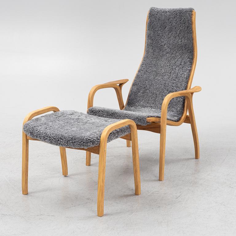 An Yngve Ekström armchair with footstool, "Lamino", Swedese, 21st century.